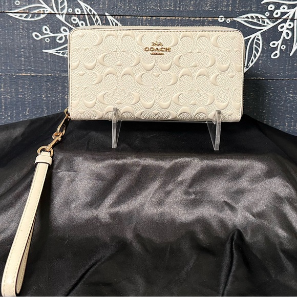 Coach Handbags - (NWOT) Coach Cream Wallet Wristlet with Signature Embossed Design
